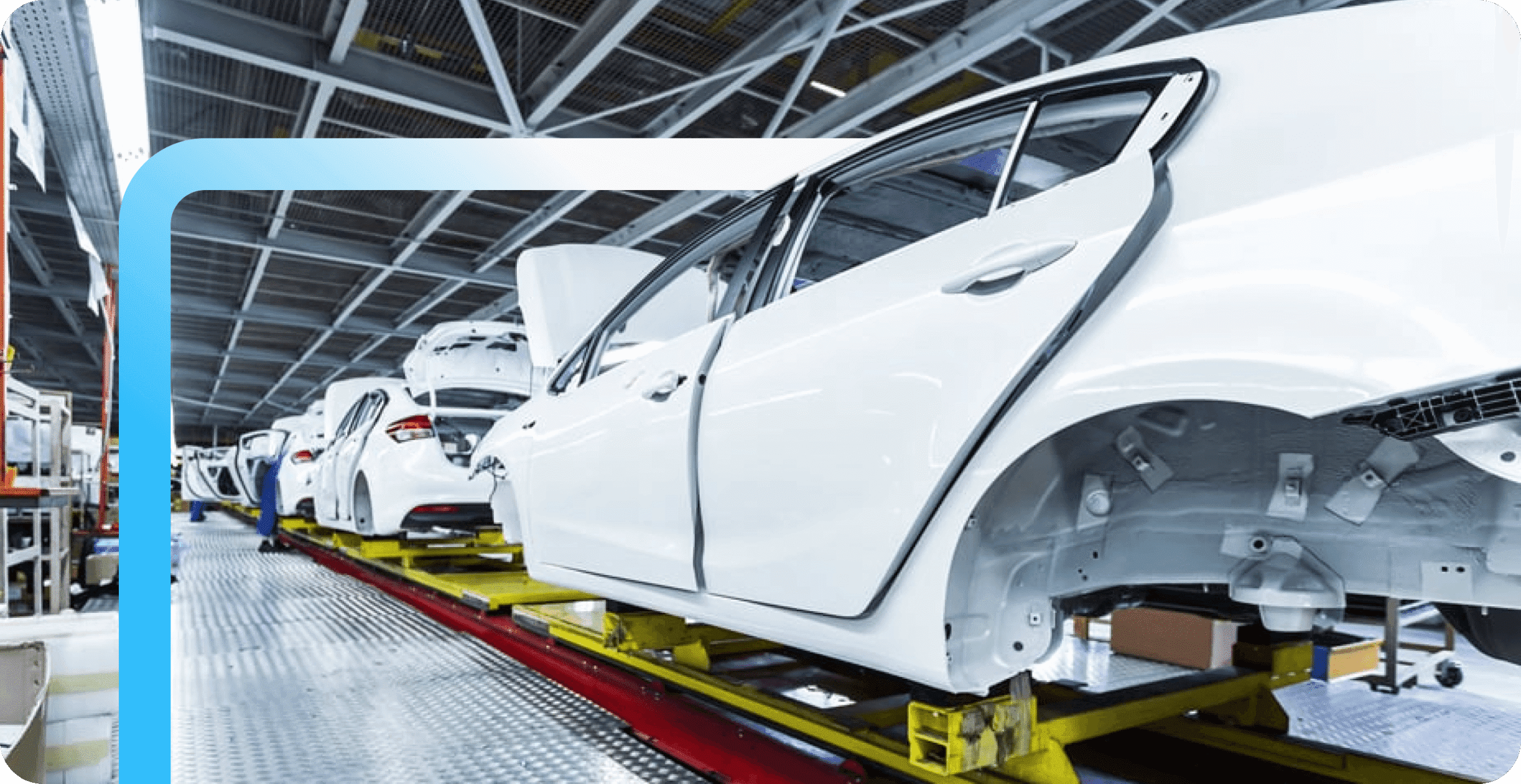 White car bodies lined up on an automotive factory assembly line with open doors and exposed frames on yellow platforms.