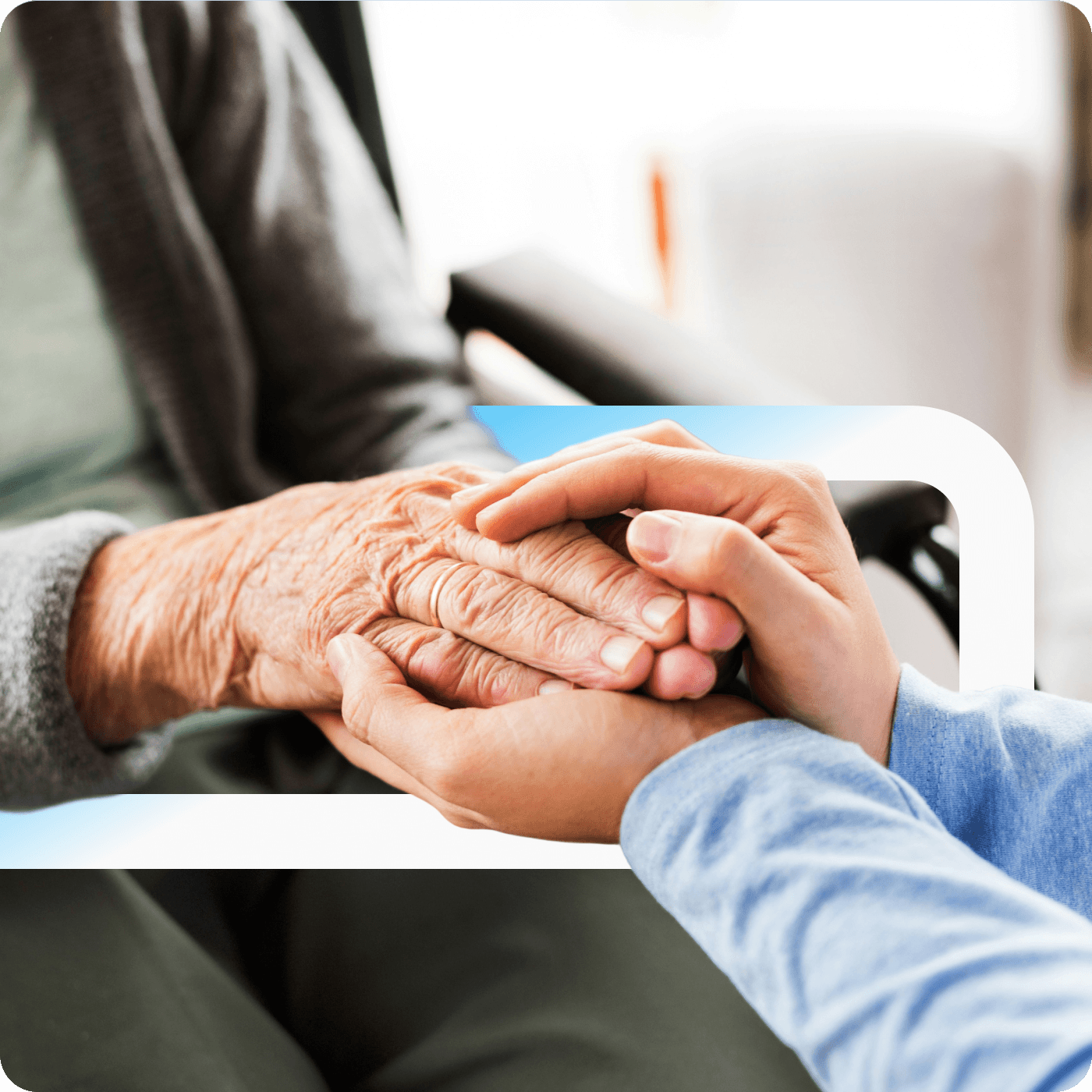 A younger person's hands gently holding an elderly person's wrinkled hand in a caring gesture, with the Alzheimer Nederland