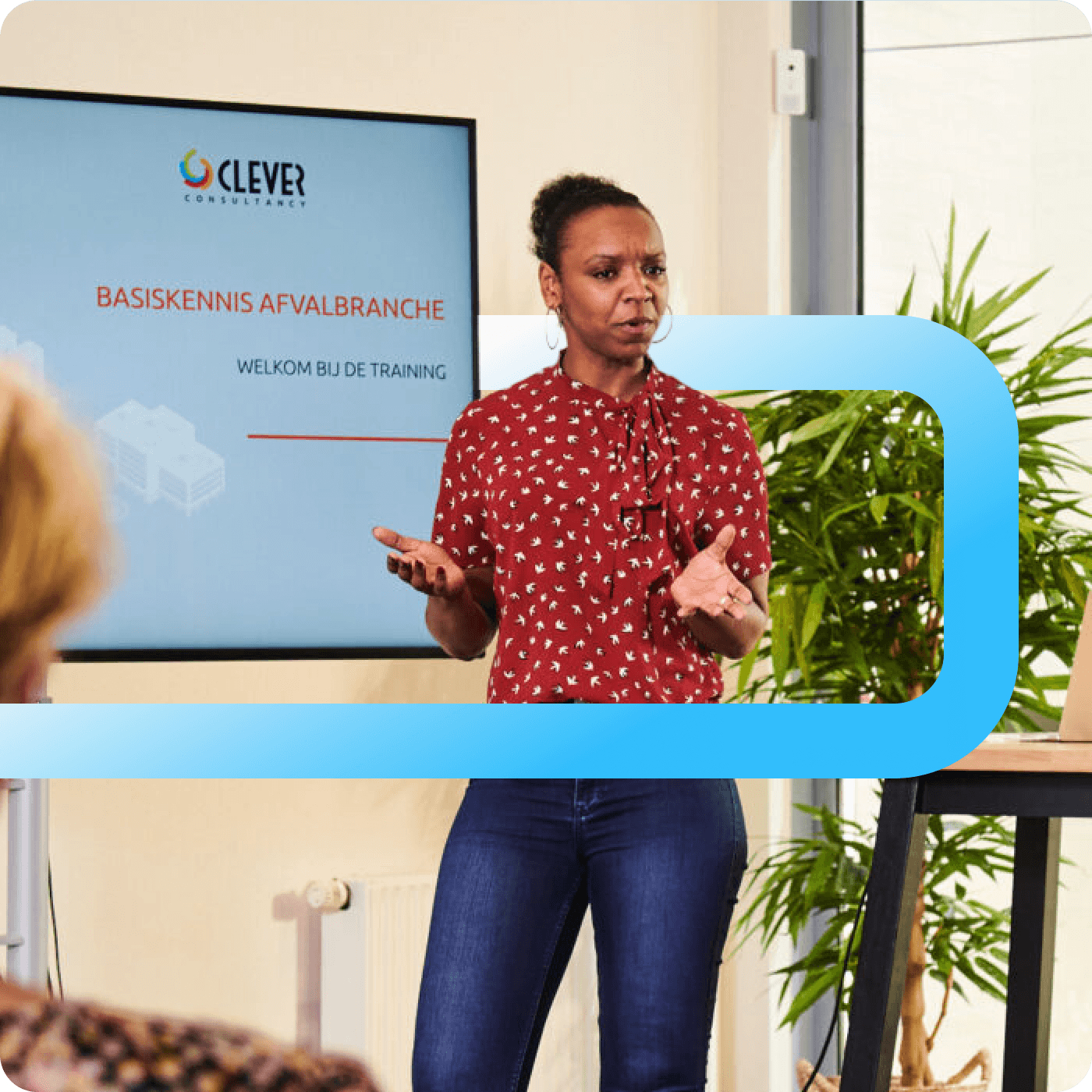 A woman in a red patterned blouse presents a Clever Consultancy training session on waste industry basics.